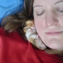 Woman sleeping with hamster